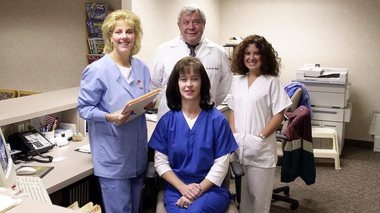 Dr. Joseph Kump and staff in 1989