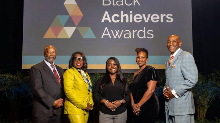 The 2024 Black Achievers Awards honorees pose on stage during the Ceremony at The Parker in Fort Lauderdale.