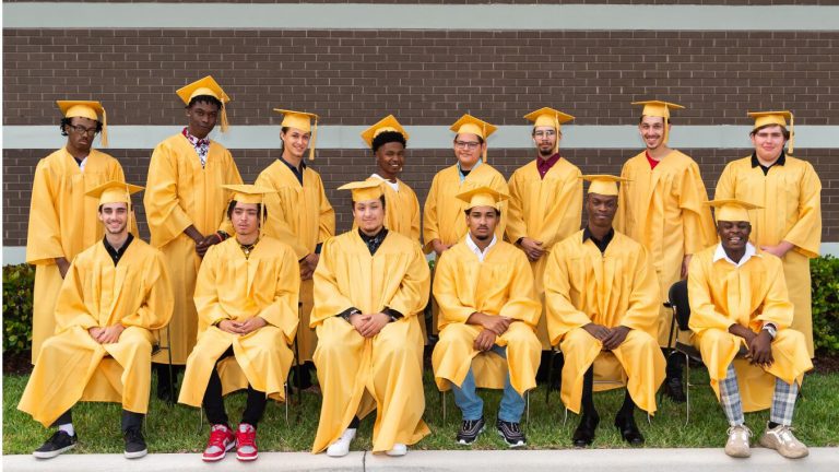 The 14 graduates in the Youth Automotive Training Center's Class of 2021