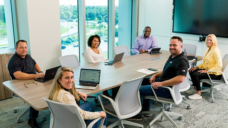 Associates in a meeting room Associates in a meeting room